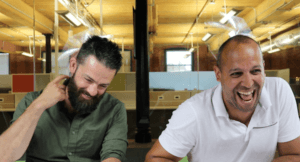 Two emagine Employees Laughing Together